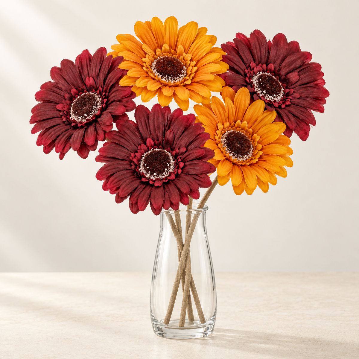 Autumn Glow artificial flowers styled in a clear glass vase. AI-generated illustration; vase not included.