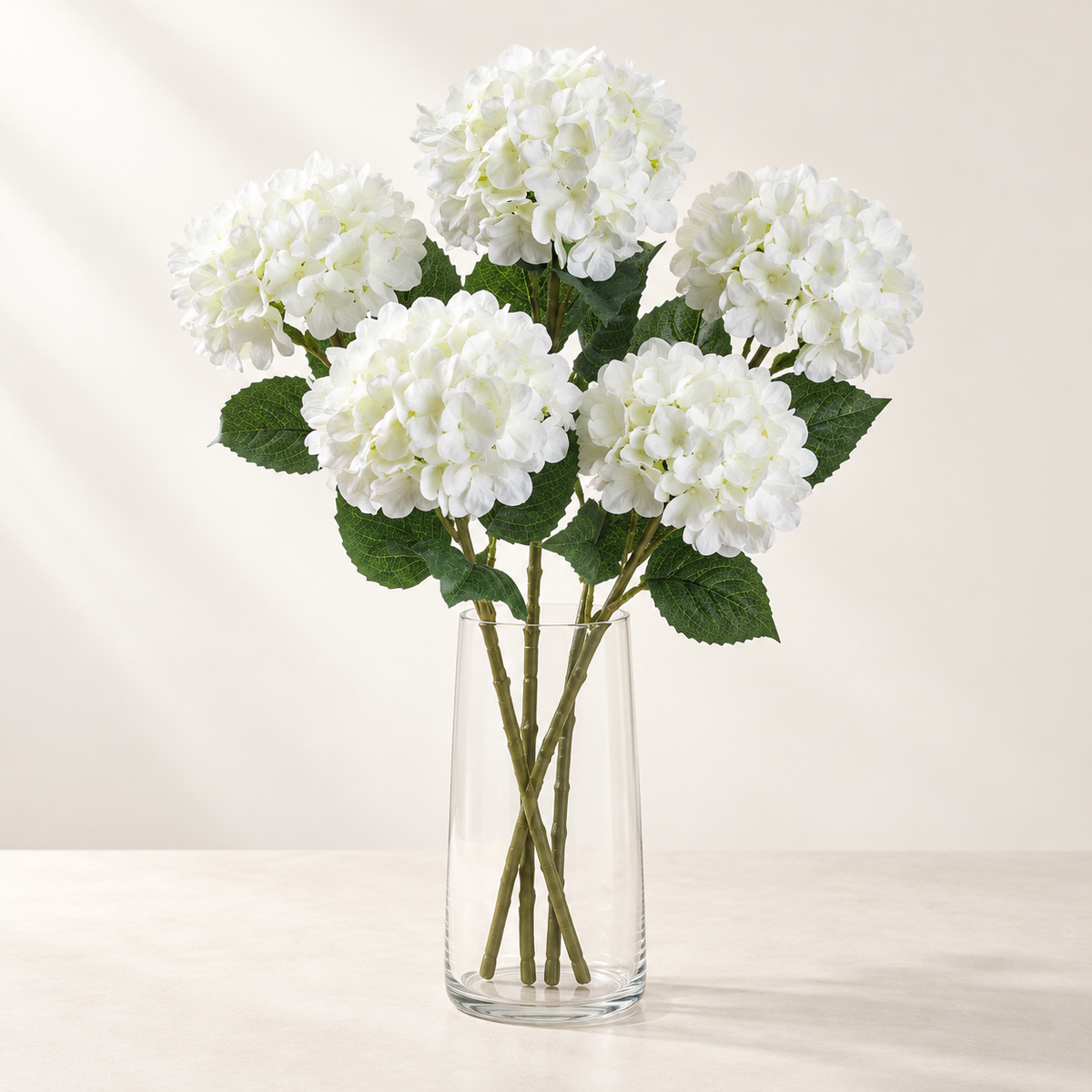 White Hydrangea (5 stems) artificial flowers in a clear glass vase. AI-generated styling illustration; vase not included.