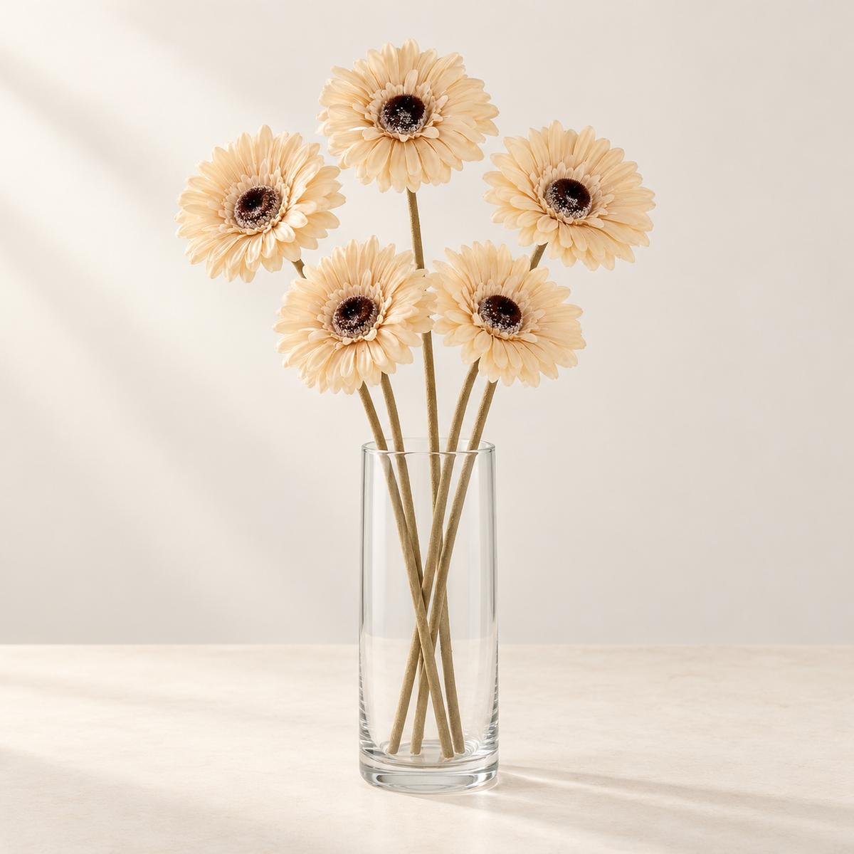 Cream Gerbera (5 stems) artificial flowers in a clear glass vase. AI-generated styling illustration; vase not included.