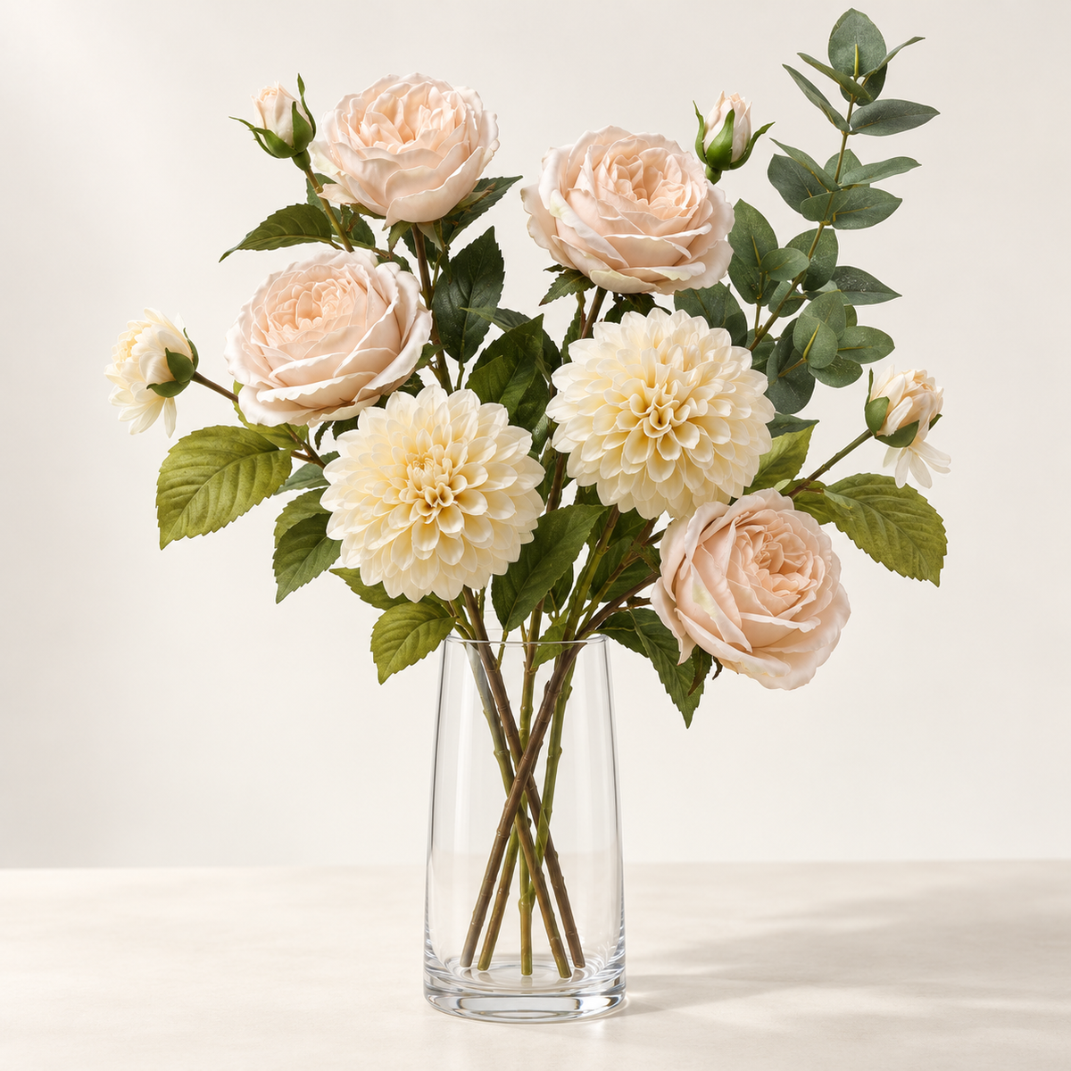 Ivory & Champagne artificial flowers styled in a clear glass vase. AI-generated illustration; vase not included.