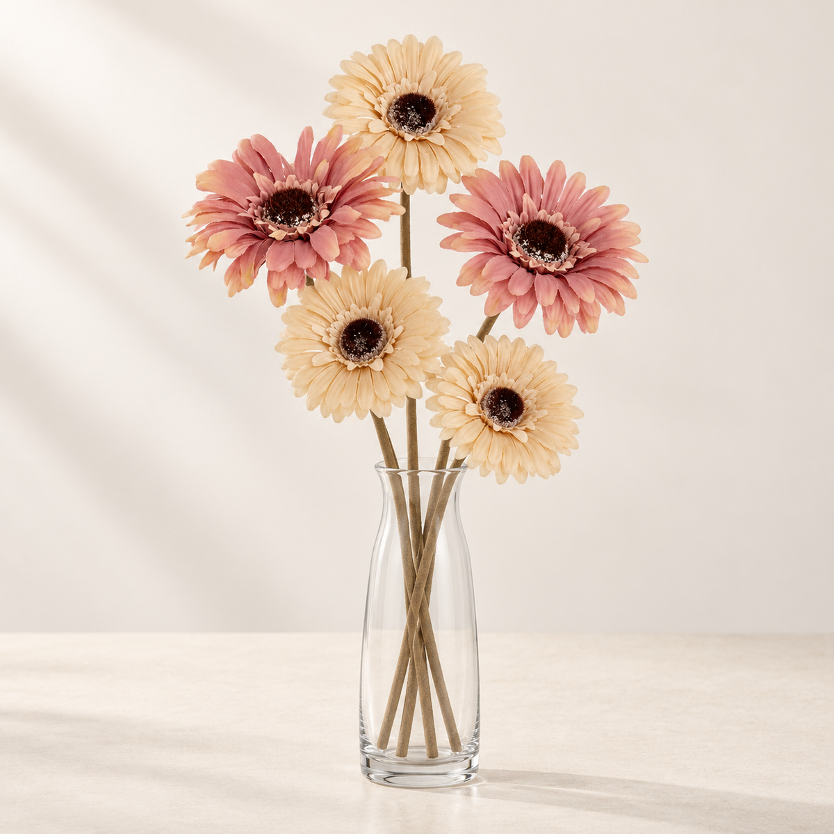 Peaches & Cream artificial flowers styled in a clear glass vase. AI-generated illustration; vase not included.