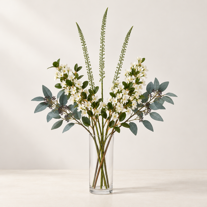 White Spire artificial flowers styled in a clear glass vase. AI-generated illustration; vase not included.